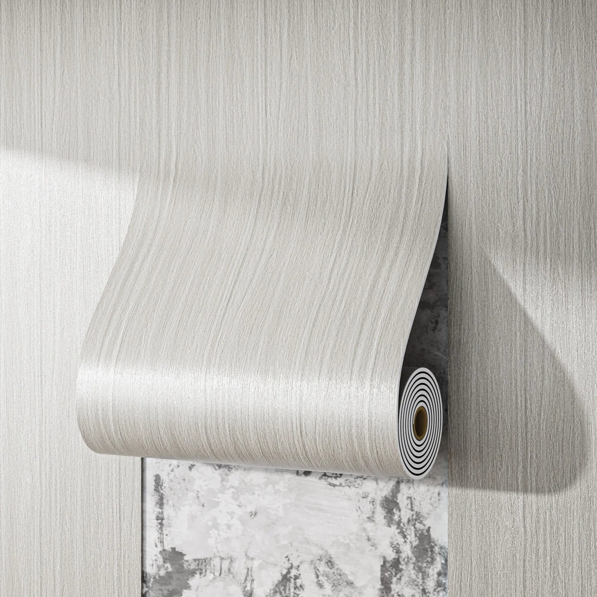 A roll of self-adhesive wood grain wall sticker is mounted on a light gray wall, showing its texture and roll.