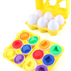 A yellow plastic sorting puzzle with multiple colored egg-shaped pieces.