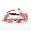 A set of pink crystal chip stone braided bracelets made with macrame knotting.