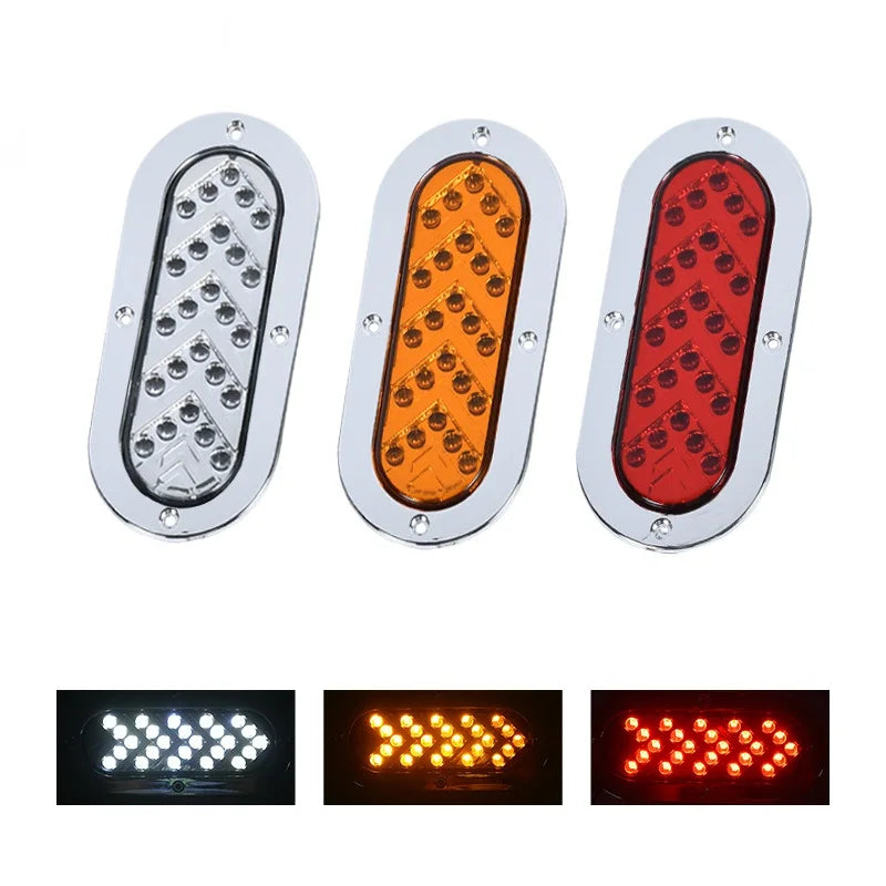 Three oval LED trailer tail lights showing amber, orange, and red turn signal patterns.