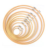 A set of bamboo embroidery hoops in various sizes, ranging from 10cm to 36cm, with adjustable screws.