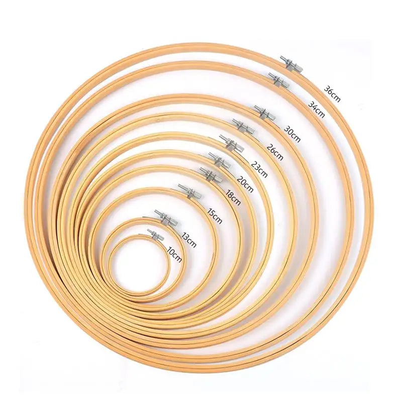 A set of bamboo embroidery hoops in various sizes, ranging from 10cm to 36cm, with adjustable screws.