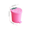 Pink strawberry-shaped mini trash can with a green leaf lid