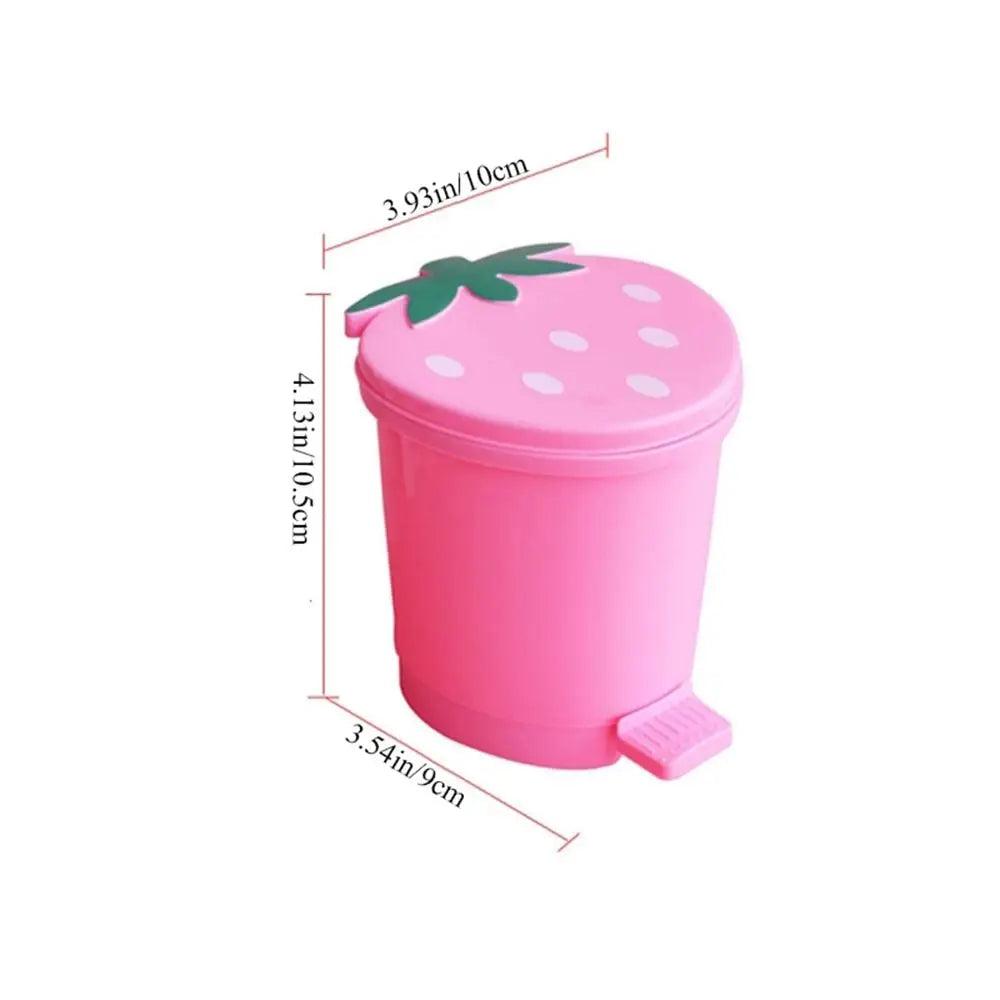 Pink strawberry-shaped mini trash can with a green leaf lid