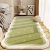 A rectangular light green plush non-slip decorative area rug placed on a wooden floor.