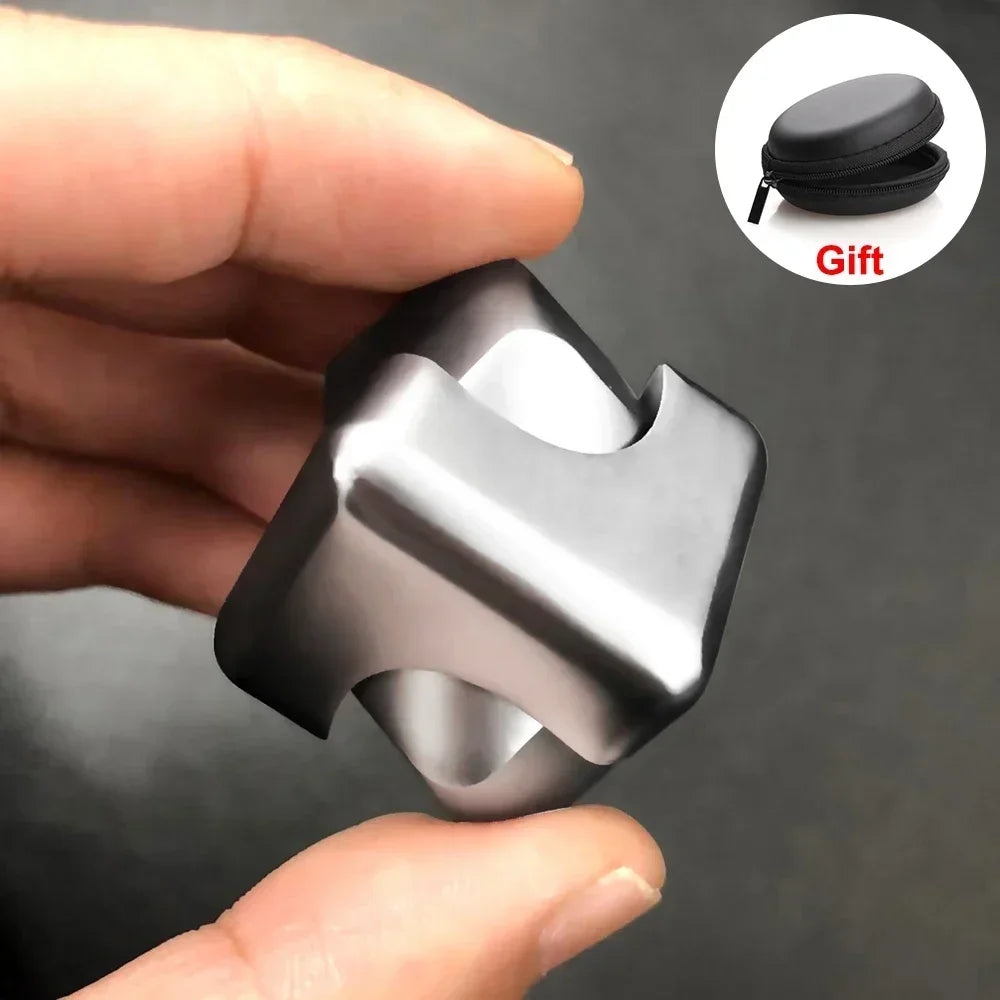 A hand holds a silver alloy metal fidget cube spinner, showing its texture and design.