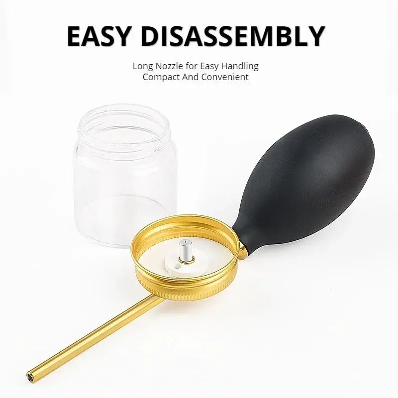 A gold-colored nozzle and black spoon are shown next to a clear glass jar, demonstrating an easy disassembly tool for a hair 