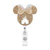 A gold glitter Mickey Mouse shaped badge reel with a nurse icon and retractable ID holder.