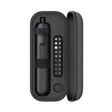 A black electric screwdriver with a cylindrical body and a side panel showing various buttons and controls.
