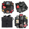 A black photo gift box featuring various themed photo cards and a black box with a ribbon.