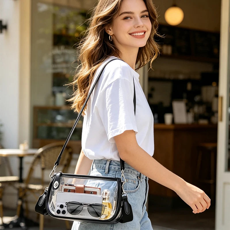 A young woman smiling while holding a clear PVC shoulder bag with an adjustable strap.