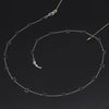 Silver chain necklace featuring a star and moon pendant design