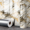 Roll of 3D marble peel-and-stick waterproof wall panels displayed next to a finished marble column.