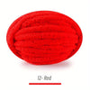 A ball of bright red extra thick chenille yarn for hand knitting