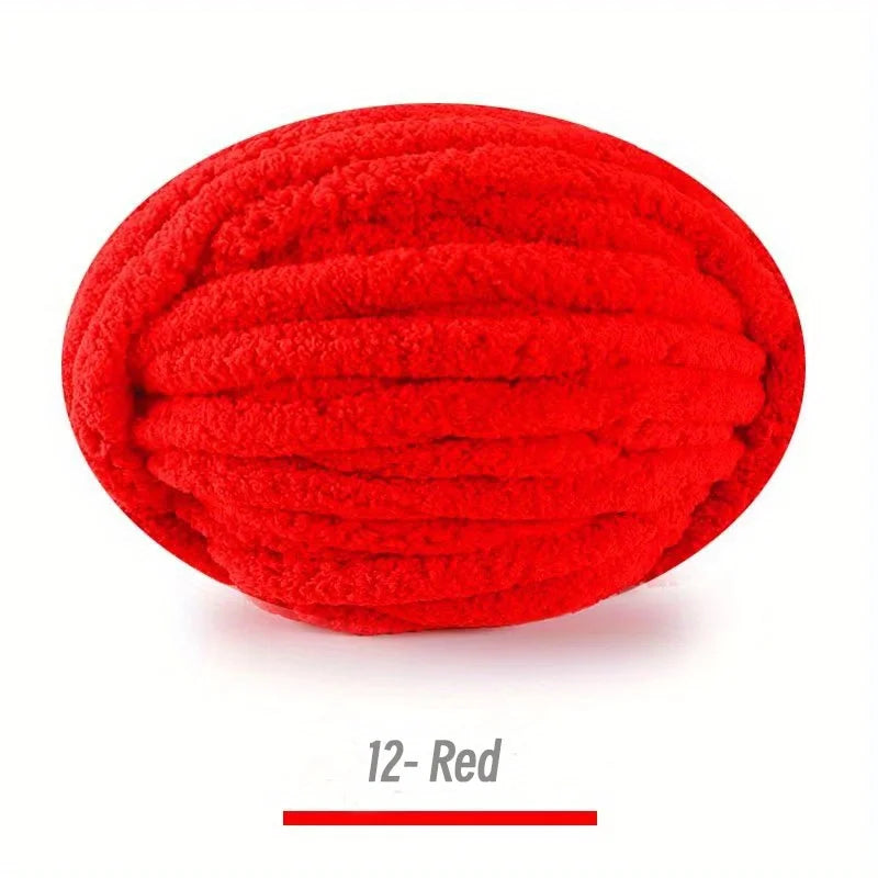 A ball of bright red extra thick chenille yarn for hand knitting
