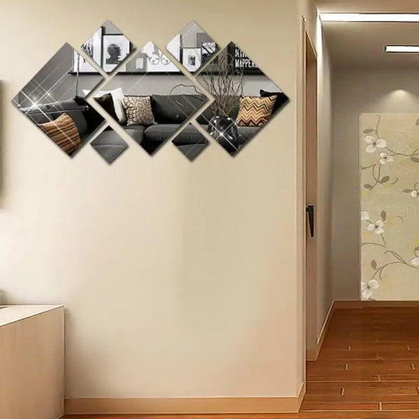 Decorative wall art featuring geometric acrylic mirror stickers with black and gold accents.