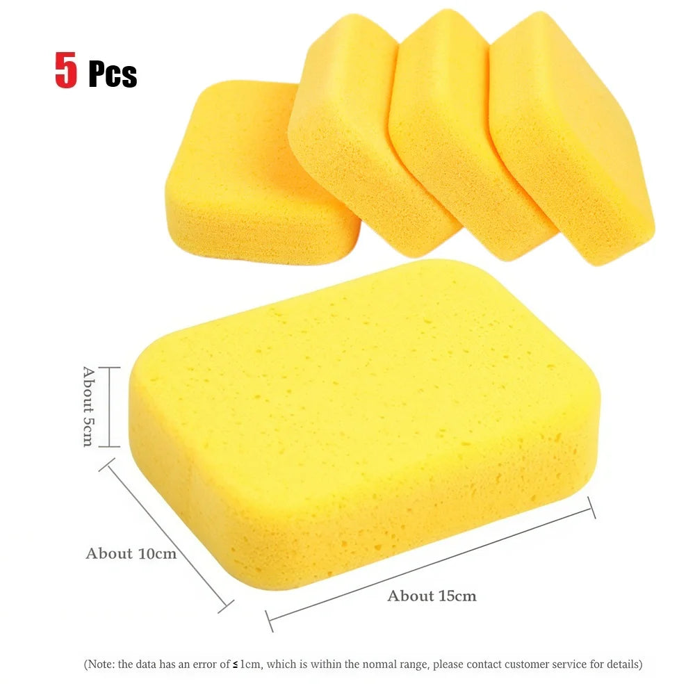 A set of five yellow high-density car wash sponges for auto detailing and waxing