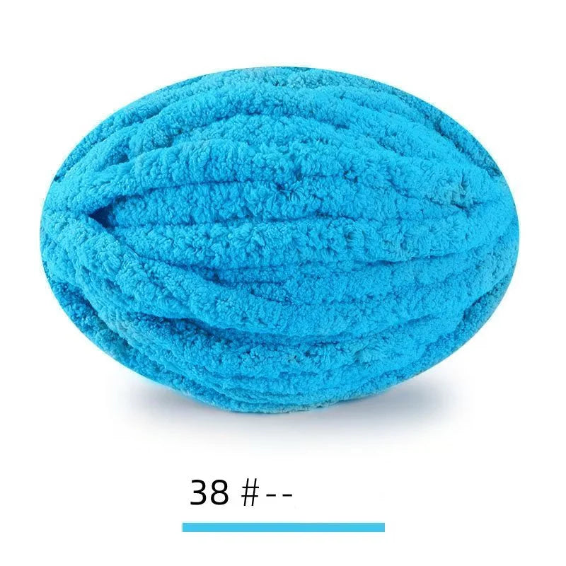 A ball of bright turquoise chenille yarn used for hand knitting projects.