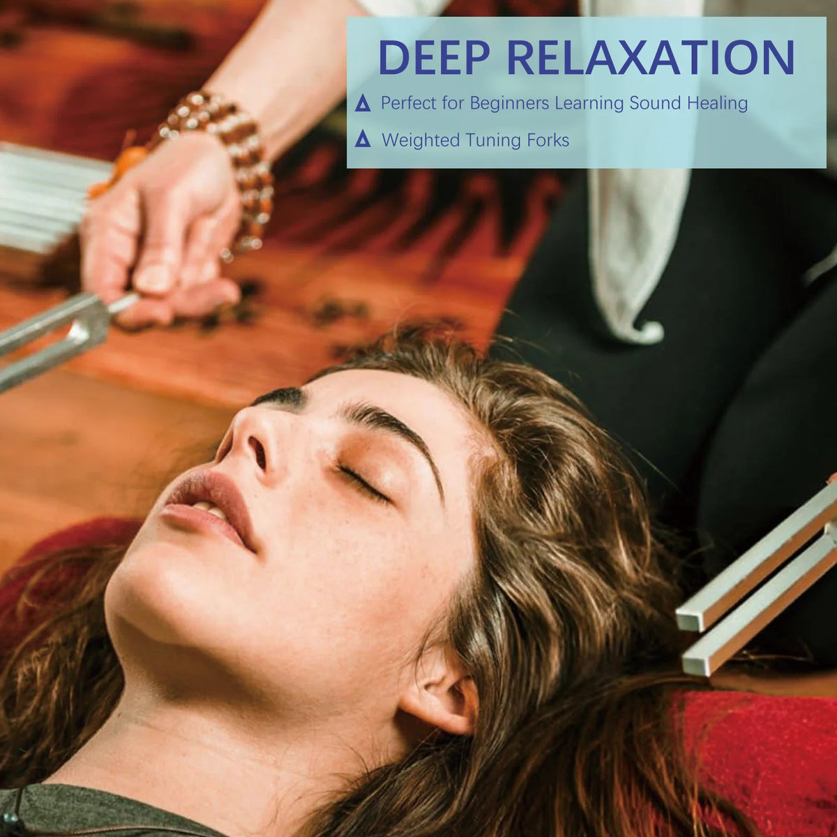 A woman is using a tuning fork set for sound healing, demonstrating deep relaxation.