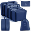 A set of navy blue travel packing cubes and storage organizer bags shown in various sizes.