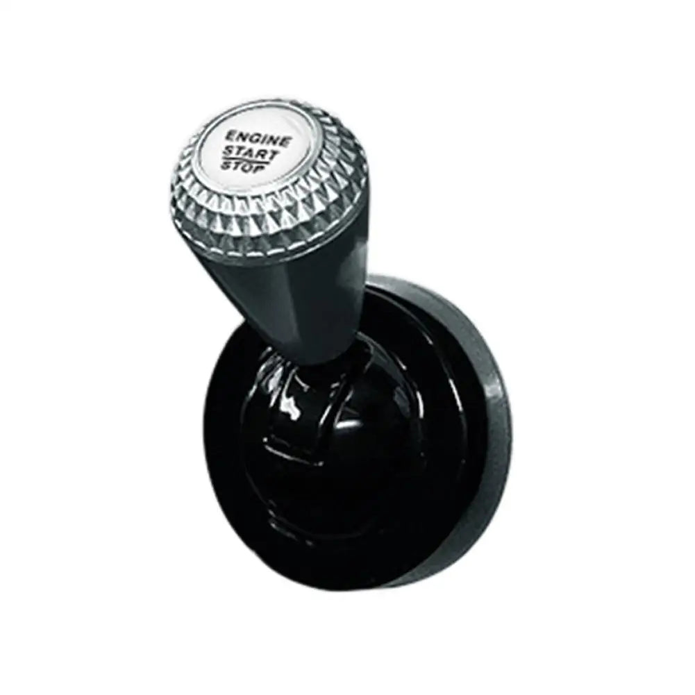 Black aluminum engine start button cover with a diamond pattern texture