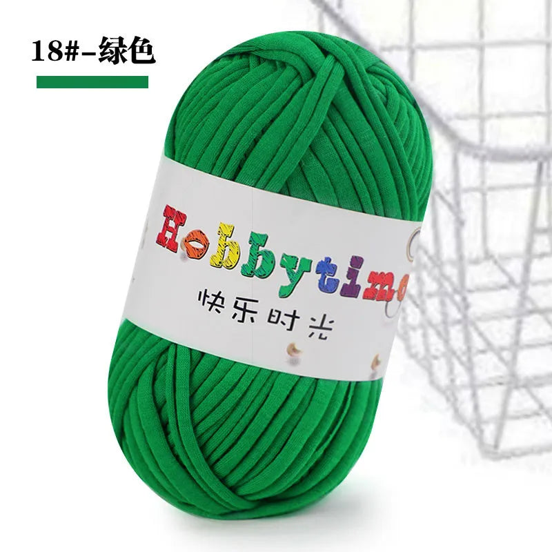 A ball of bright green soft T-shirt yarn for crochet and knitting is shown against a white background.