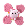 A pink silicone suction cup spinner bath toy shaped like a cute, round animal for toddlers.