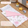 A pink floral toddler nap mat featuring a removable pillow and fleece blanket on a wooden floor.