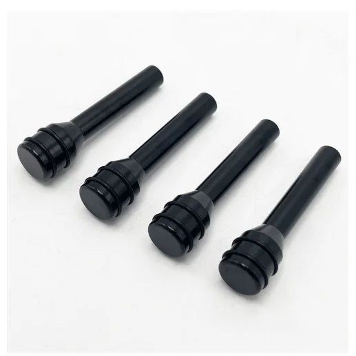 A set of black aluminum alloy car door lock pins for universal fit.
