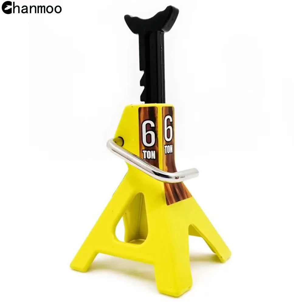 A yellow heavy-duty metal car jack stand with a black scissor-style lifting tool is shown.