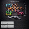 Neon sign spelling out It's Coffee Time in orange and pink letters on a black background