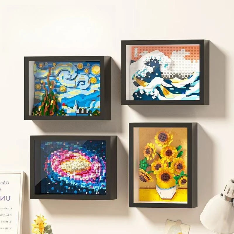 A framed piece of art depicting a starry night landscape created with colorful diamond building blocks.