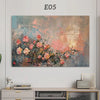 An abstract painting featuring soft pink and orange tones with floral elements, displayed above a TV cover.