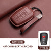 A brown leather cord with a key case cover and a metal clip, matching the date red color.