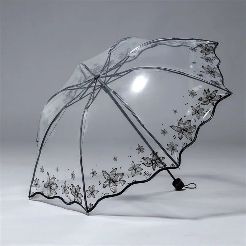 A clear, retro transparent arch umbrella with a floral design is shown against a light gray background.