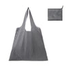 A black and white checkered reusable shopping tote bag with a matching fabric carry pouch.