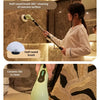 Demonstration of a cordless electric spin scrubber with various brush heads cleaning a ceramic tile surface.