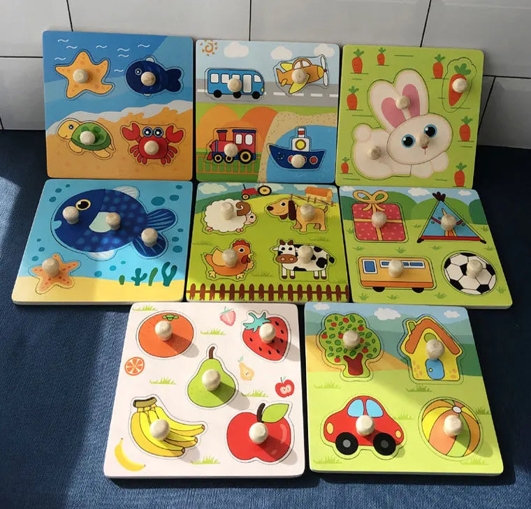 A set of wooden alphabet and number peg puzzles featuring various animals, vehicles, and fruits for toddlers.