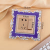 A rectangular switch cover frame with a purple border and silver decorative edges is shown on a light background.