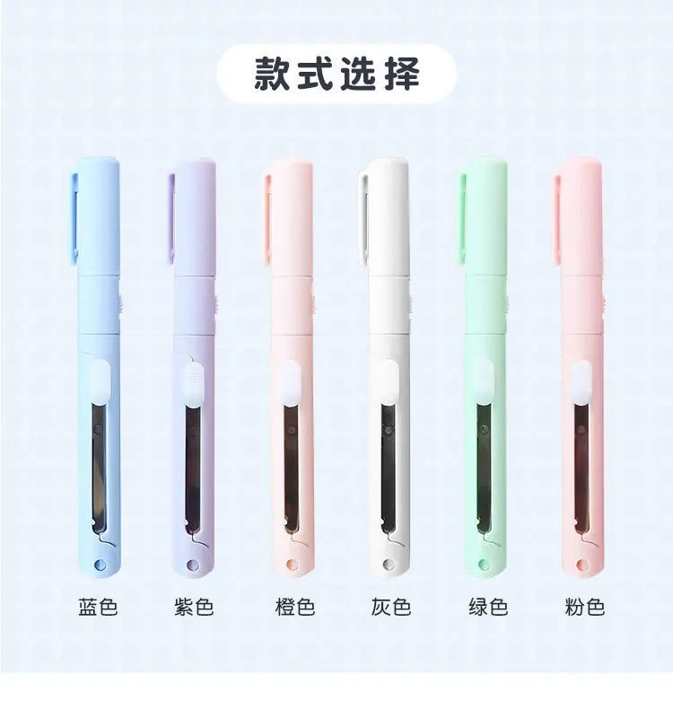 A row of five folding pen-shaped safety scissors in various colors including blue, purple, pink, white, green, and peach.