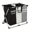 A foldable waterproof laundry basket with handles and sorting compartments in black, white, and gray.