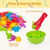 A set of bright colored animal sorting toys designed for children's hands, including plastic figures and a green bowl.