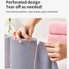 Hands are tearing off a gray microfiber cleaning cloth to use it, demonstrating its tear-off design.