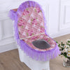 A purple and pink floral quilted toilet seat cover set with a washable cushion