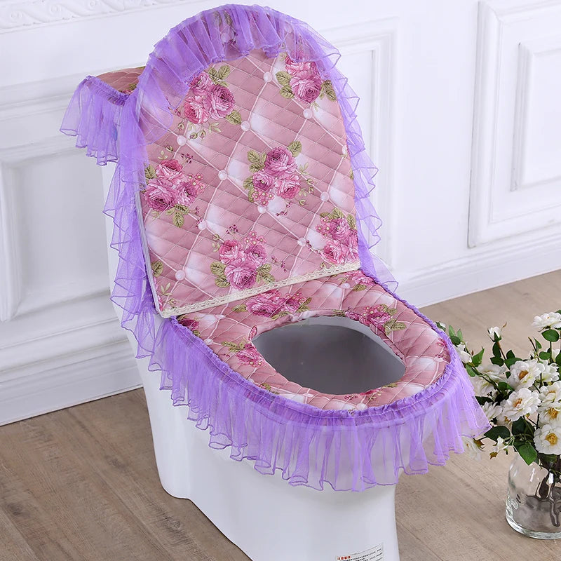 A purple and pink floral quilted toilet seat cover set with a washable cushion