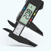 A black digital caliper is shown with a screen displaying 2.018 mm and a measuring scale.