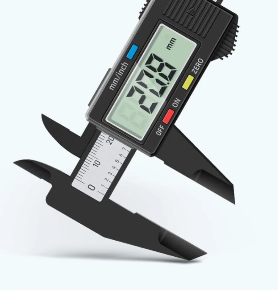 A black digital caliper is shown with a screen displaying 2.018 mm and a measuring scale.