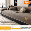 A cozy anti-slip lamb fleece sofa mat in brown and cream colors shown on a sofa.