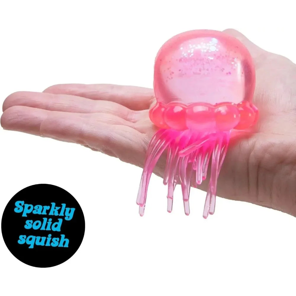 Eine Hand hält ein pinkes, durchsichtiges Quetschspielzeug mit rosa Tentakeln.