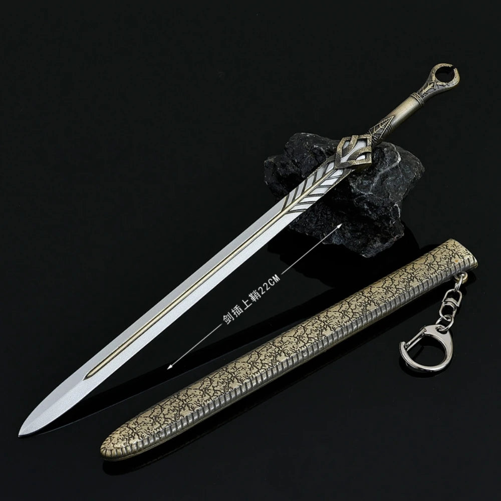 A detailed metal sword with a decorative hilt and a textured blade is displayed next to its keychain.